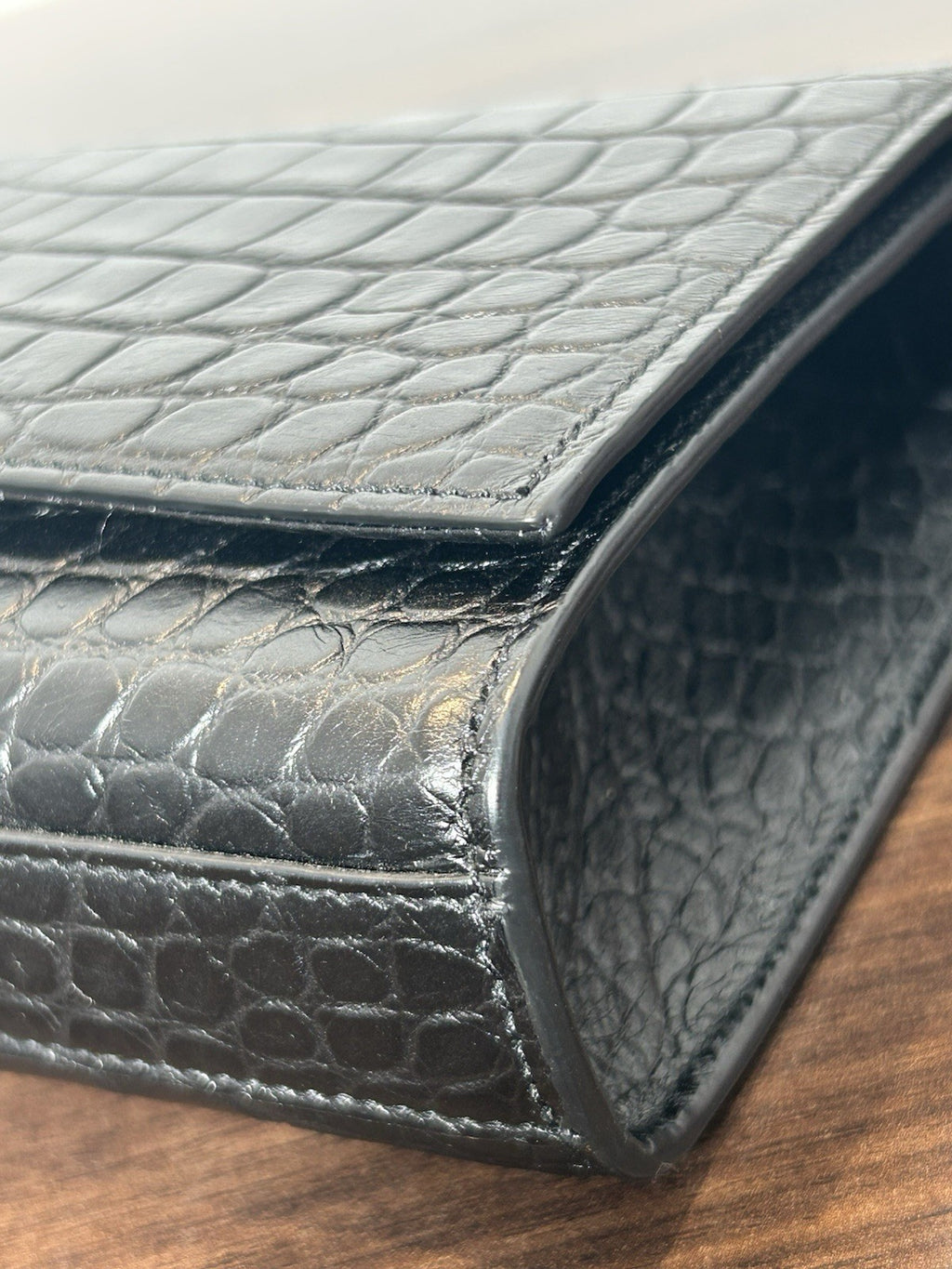 YSL Saint Laurent Calfskin Crocodile Embossed Monogram Tassel Clutch Kate Black